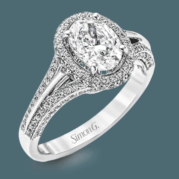 Women’s platinum diamond engagement rings-This lovely 18k white gold engagement ring design is created for an elegant oval center stone and features .77 ctw of white diamonds accented by a small touch of .03 ctw of yellow diamonds.