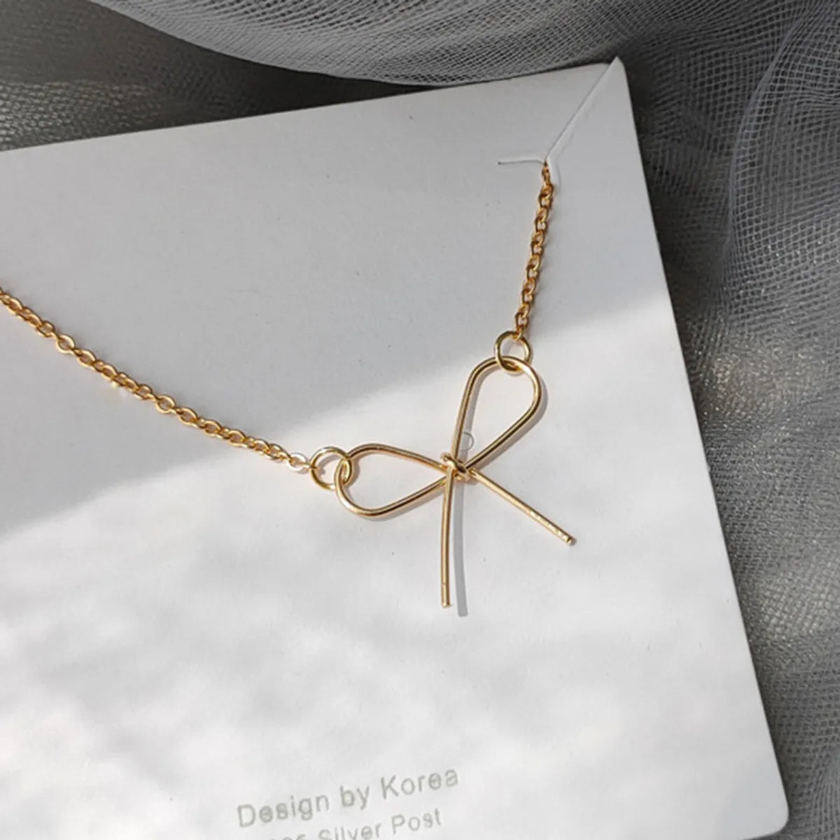 Women’s customized necklaces-Geometric Bow Shaped Simple New Hollow Pendant Clavicle Necklace Alloy