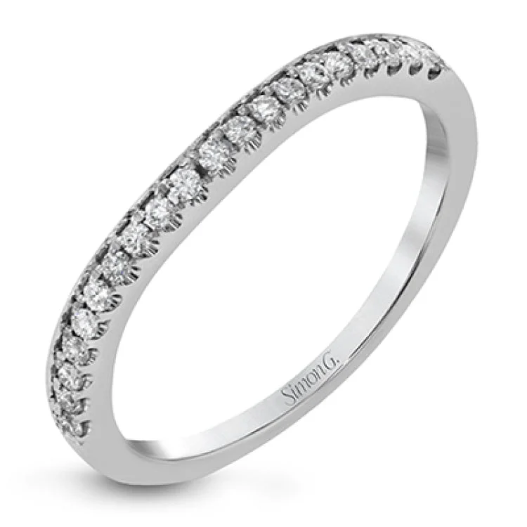 Women’s oval engagement rings-The elegant design of this classic white gold engagement ring is set with .62 ctw of round cut white diamonds and .40 ctw pear shaped white diamonds.