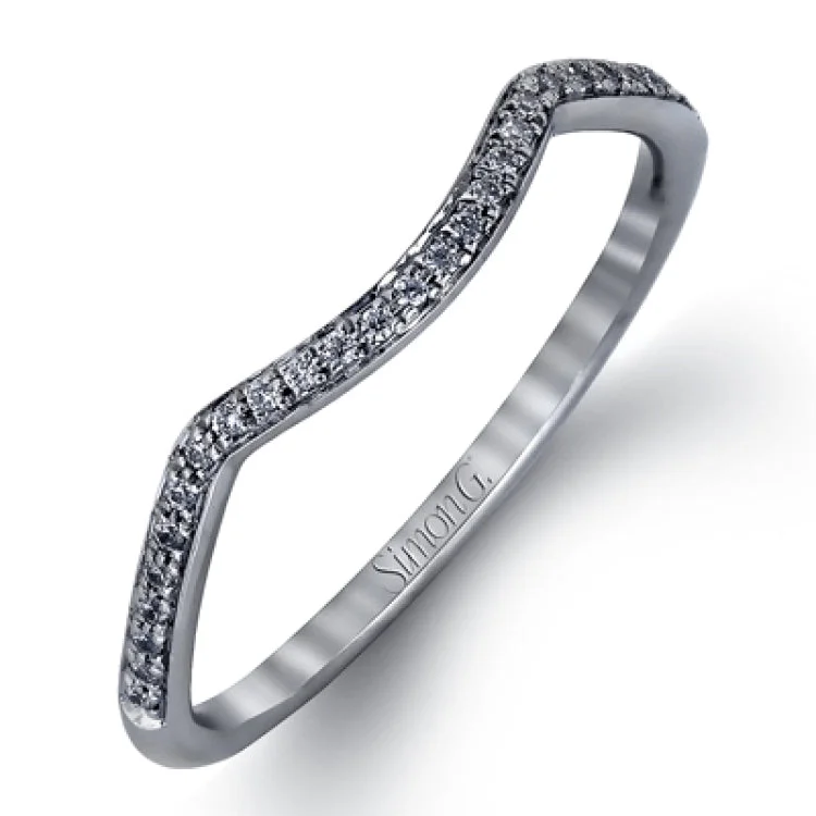 Women’s silver engagement rings-This sparkling modern white gold engagement ring and wedding band set features an eye-catching twisted design accented by .22 ctw of shimmering round cut white diamonds.