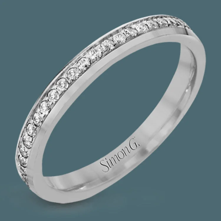 Women’s halo engagement rings-This classic wedding band features .27 ctw of white diamonds set in white gold, while the interior of the ring is rose gold.