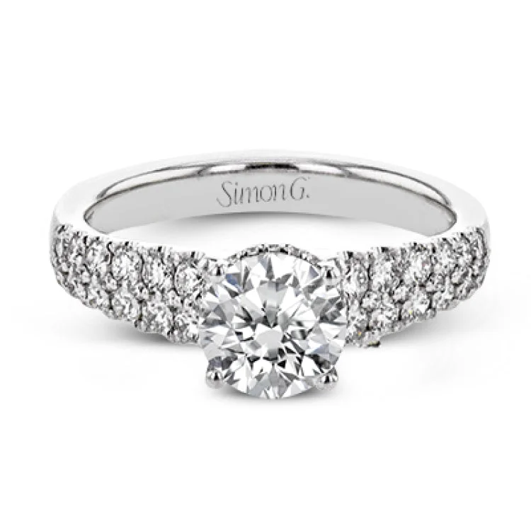 Women’s diamond engagement rings-Shining white diamonds encircle the center stone in this Underhalo engagement ring, while also extending across the sides of the ring to ensure it glitters from all directions.