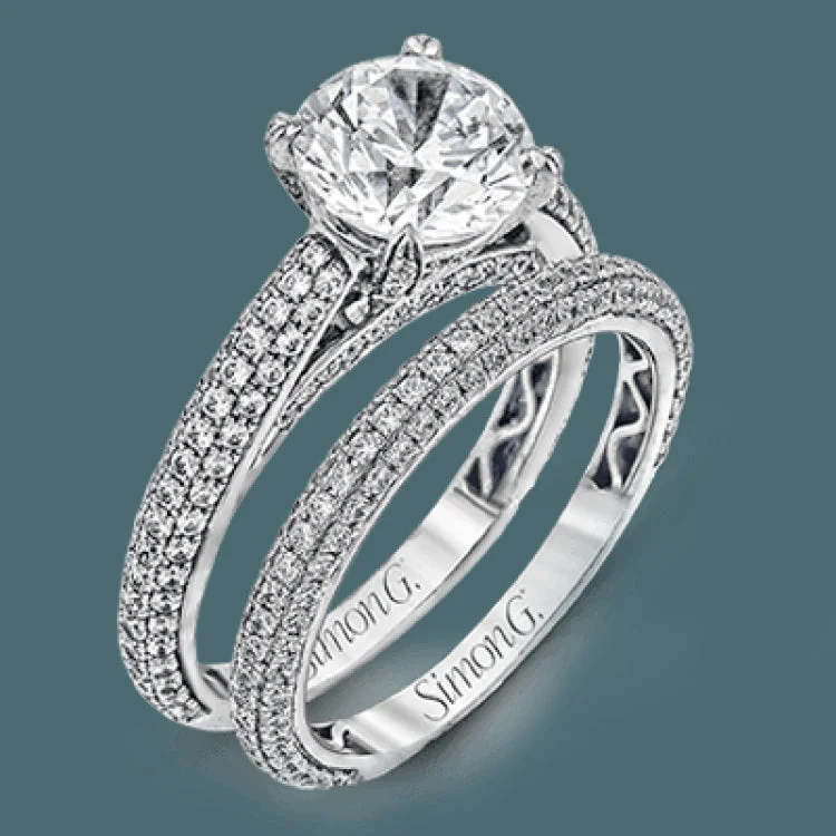 Women’s elegant engagement rings-This classically styled white gold engagement ring is set with 1.30 ctw of shimmering white diamonds in a stunning design.