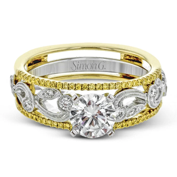 Women’s antique engagement rings-This remarkable set provides the looks of three rings, with a yellow gold ring guard set with yellow diamonds that encompasses the center white gold engagement ring.