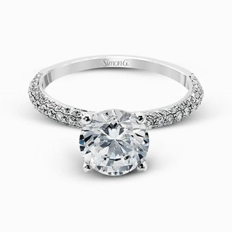 Women’s classic solitaire engagement rings-Presenting an eye-catching modern design, this white gold engagement ring and wedding band are highlighted by 1.45 ctw of round cut white diamonds.