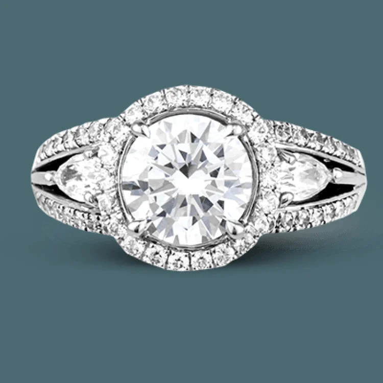 Women’s diamond rings with intricate designs-Reflecting a charming vintage design, this dazzling white gold engagement ring features .63 ctw of round cut white diamonds and .51 ctw of pear shaped white diamonds.