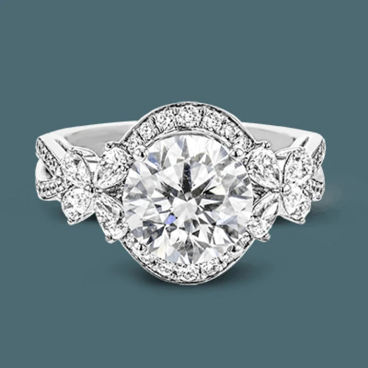 Women’s three-stone engagement rings-Dramatic yet romantic, this exquisite white gold engagement ring features .61 ctw of round cut white diamonds highlighted by .58 ctw of pear shaped diamonds in delicate floral motifs.