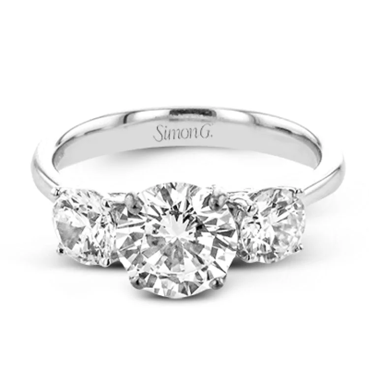 Women’s round engagement rings-This remarkable engagement ring is our take on a classic three stone, with an intricate side design and 1.00 ctw side diamonds.