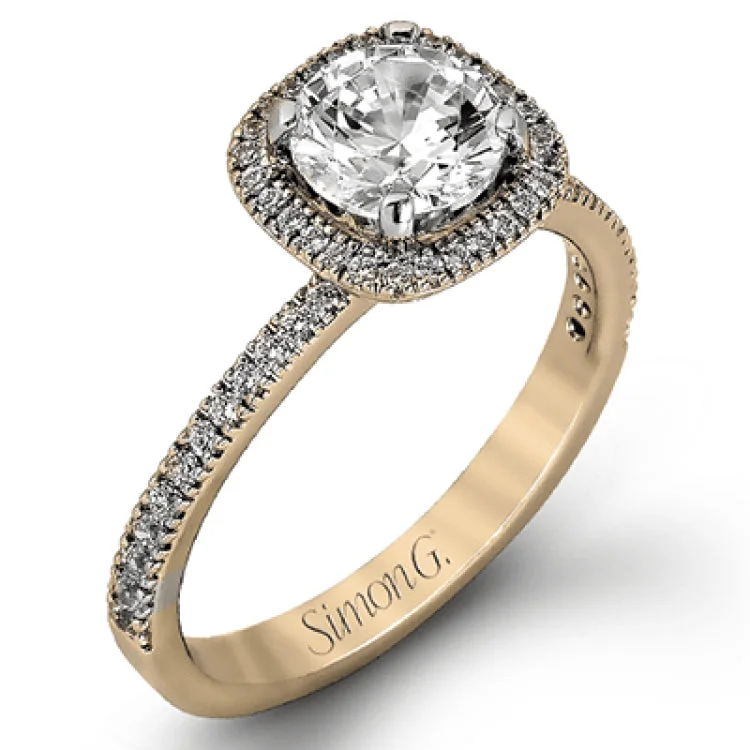 Women’s engagement rings with colored stones-Accented by .46 ctw of glistening round cut white diamonds, this contemporary white gold halo style engagement ring and wedding band set makes a dramatic statement.