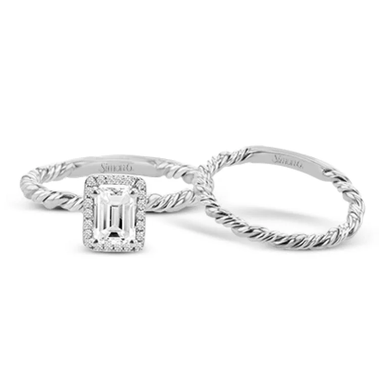 Women’s affordable platinum engagement rings-This halo engagement ring employs a twist of yellow and white gold together, and is made for an emerald shape center stone.