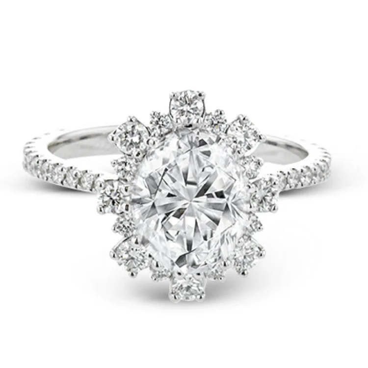 Women’s vintage diamond engagement rings-A geometric halo of diamonds in this Supernova Collection engagement ring replicates the effect of a thousand stars.