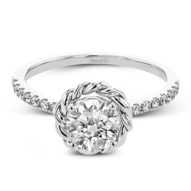 Women’s engagement rings with round diamonds-This distinctive engagement ring features .40 ctw of white diamonds on the shank of the ring and a halo made from a twisted design of yellow and white gold.