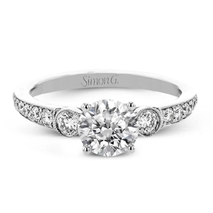 Women’s engagement rings with a halo-This Roxy Collection engagement ring takes inspiration from the past but updates it into a perfect design featuring .40 ctw of white side diamonds.