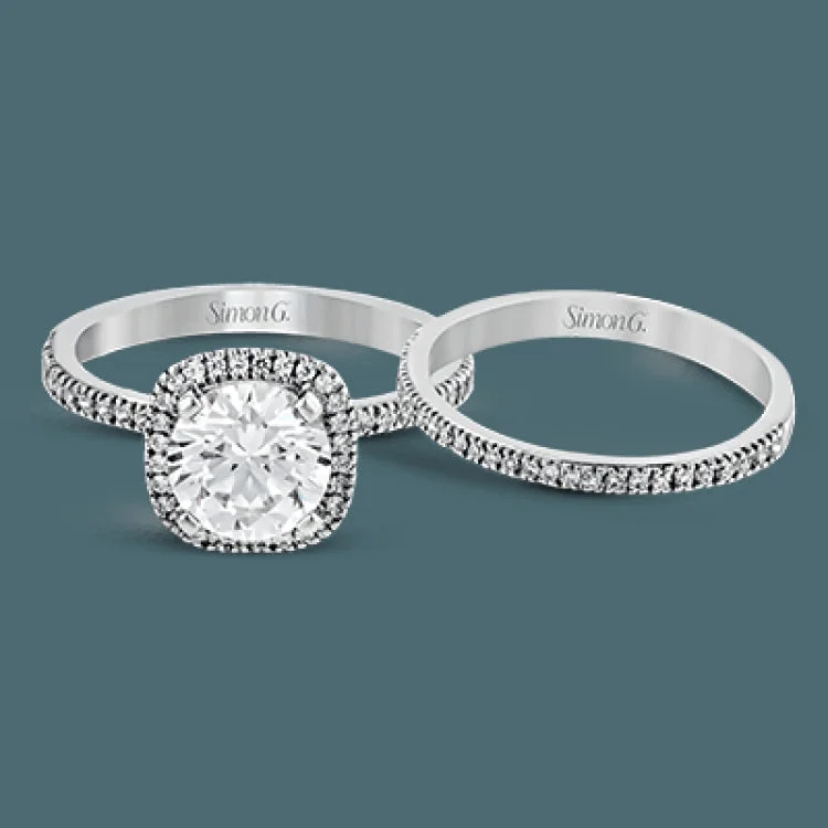 Women’s black diamond engagement rings-Featuring a contemporary take on a vintage style, this white gold engagement ring and band is complemented by .50 ctw of striking round cut white diamonds.