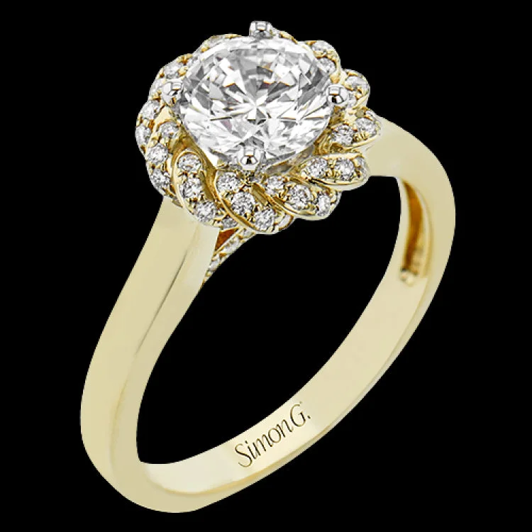 Women’s round diamond engagement rings-An 18k engagement ring with a new take on the classic solitaire design, features a twisted diamond halo 0.31 ctw., and high polished yellow band