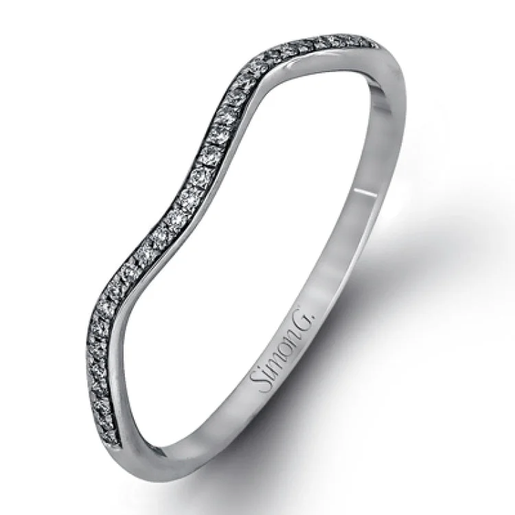 Women’s black gold engagement rings-This dramatic white gold engagement ring and wedding band set are highlighted by .23 ctw of dazzling round cut white diamonds in a distinctive modern twist design.