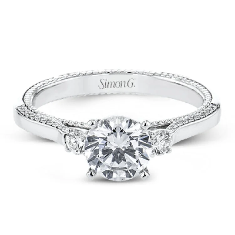 Women’s oval engagement rings-Diamond side stones, milgrain and diamond detailing on the sides of the ring add to the beauty of this unique engagement ring.