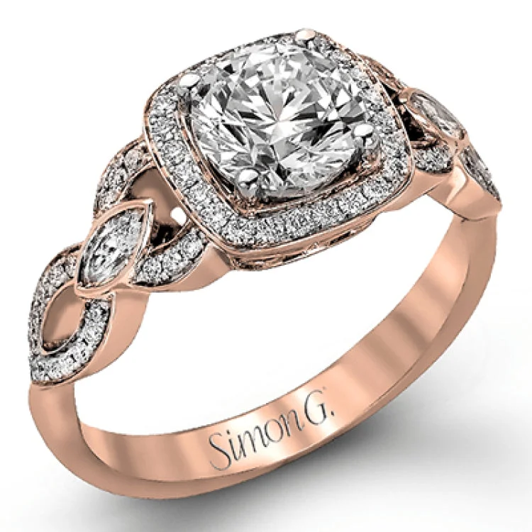 Women’s rose gold engagement rings-This impressive white gold engagement ring is accented by .23 ctw white round cut diamonds and .20 ctw marquise cut diamonds.