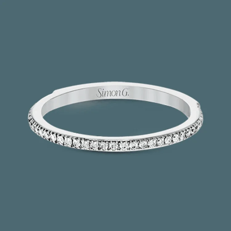 Women’s gold engagement rings with diamonds-The classic, streamlined design of this 18k white gold wedding set is accented by .30 ctw of sparkling white round brilliant diamonds.