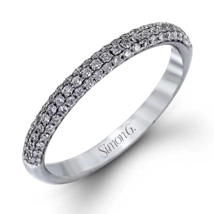 Women’s diamond halo engagement rings-The classic design of this white gold engagement ring and wedding band set is emphasized by .72 ctw round cut white diamonds.