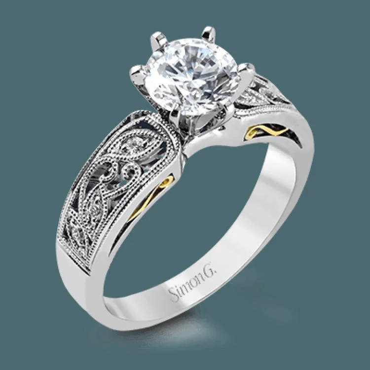 Women’s unique custom engagement rings-This intricately designed white gold engagement ring features .07 ctw of exquisite round cut white diamonds, setting the stage for a stunning center stone.