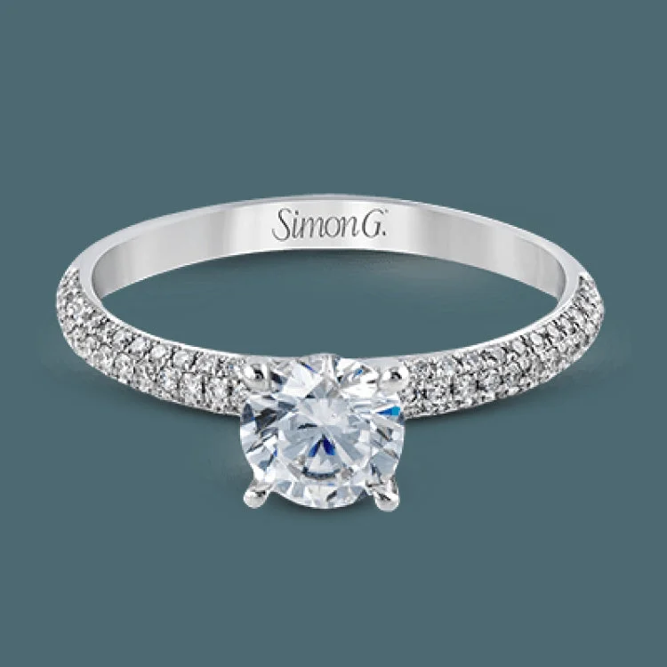 Women’s wide band engagement rings-Reflecting a simple yet elegant classic design, this white gold engagement ring and band is accented by .86 ctw white diamonds.