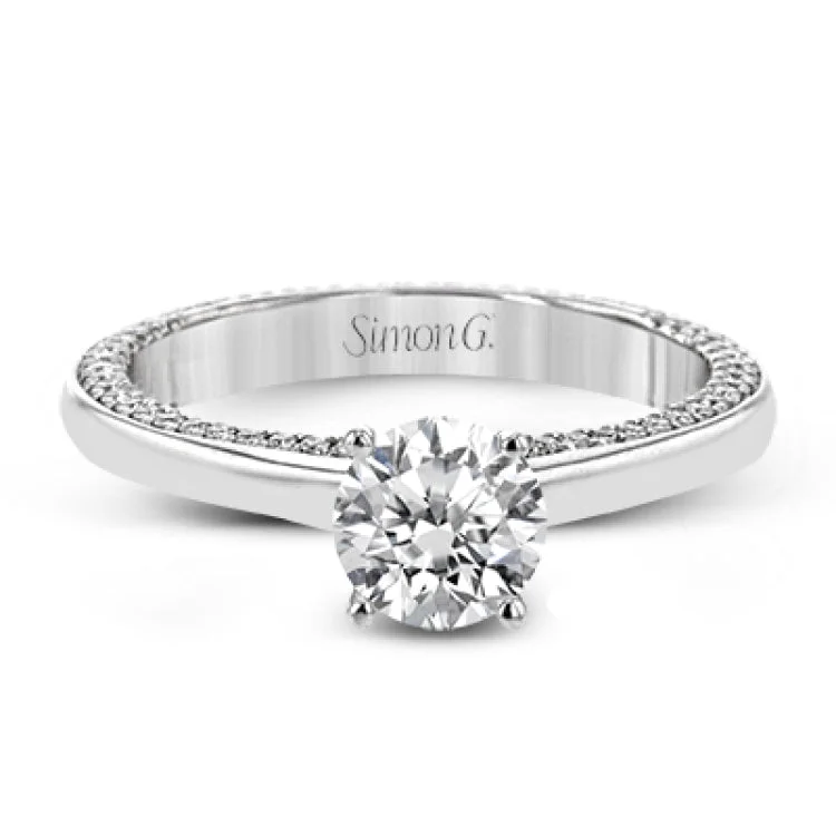 Women’s engagement rings with a romantic touch-While lines of diamonds extending down both sides of this engagement ring, the round center stone is enhanced by the pure beauty of the 18k white gold on top.