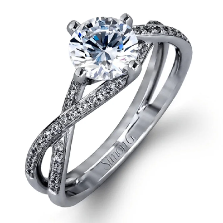 Women’s affordable engagement rings with diamonds-This sparkling modern white gold engagement ring and wedding band set features an eye-catching twisted design accented by .22 ctw of shimmering round cut white diamonds.