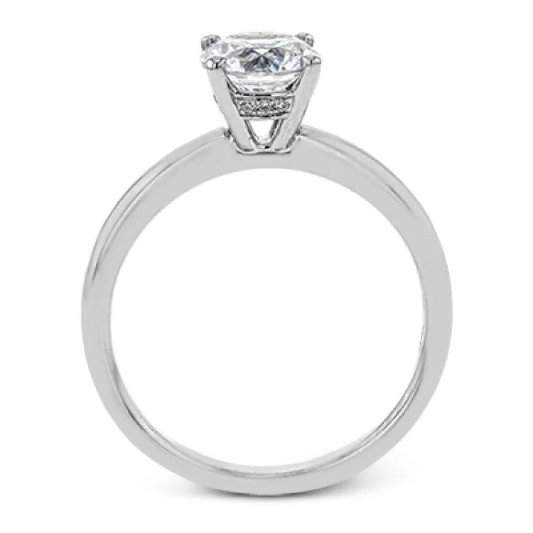 Women’s luxury wedding and engagement rings-This singular engagement accents the center stone with a touch of .03 ctw of diamonds around the secure basket setting, while the band shines in high polish metal.