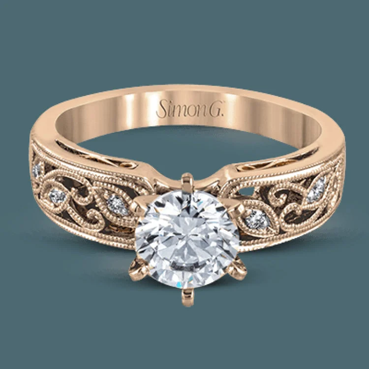 Women’s engagement rings with oval diamonds-This intricately designed white gold engagement ring features .07 ctw of exquisite round cut white diamonds, setting the stage for a stunning center stone.