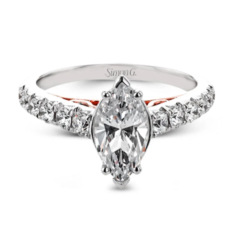 Women’s rose gold and diamond engagement rings-A touch of 18k yellow gold filigree on the interior of this ring adds a special touch to this 18k white gold engagement ring made for a marquise shape center stone.