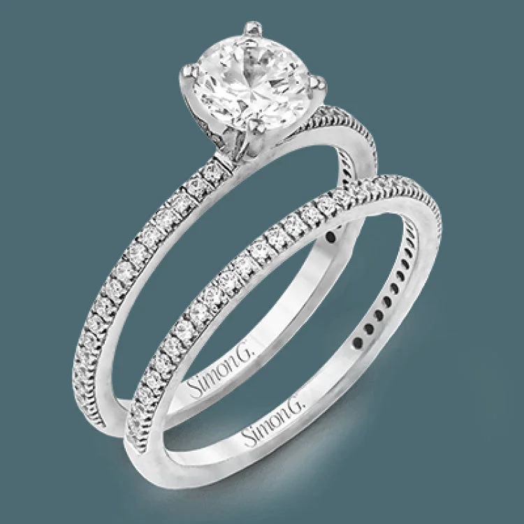 Women’s minimalist engagement rings-The classic, streamlined design of this 18k white gold wedding set is accented by .30 ctw of sparkling white round brilliant diamonds.