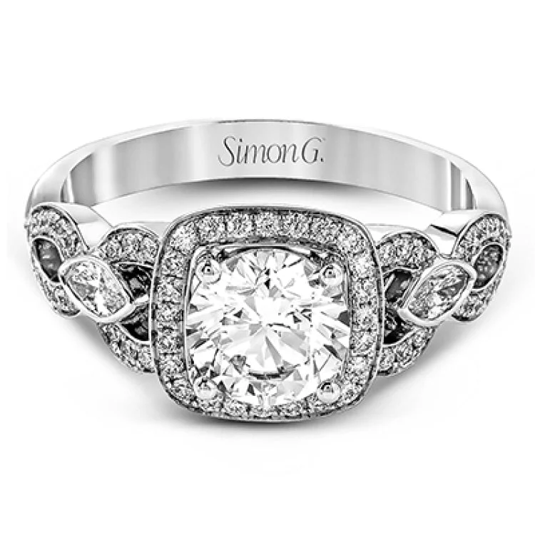 Women’s platinum engagement rings-This impressive white gold engagement ring is accented by .23 ctw white round cut diamonds and .20 ctw marquise cut diamonds.