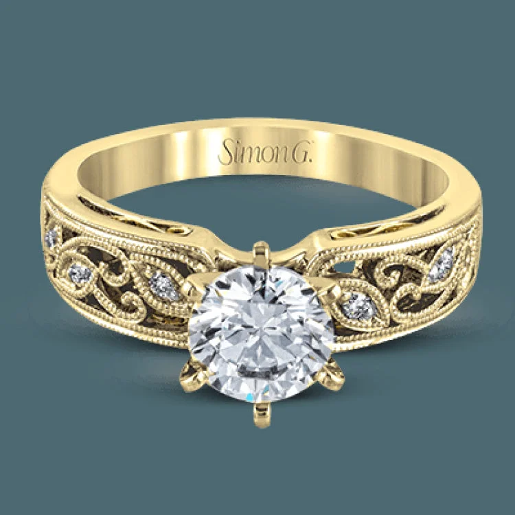 Women’s halo diamond engagement rings-This intricately designed white gold engagement ring features .07 ctw of exquisite round cut white diamonds, setting the stage for a stunning center stone.