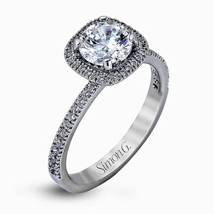 Women’s silver engagement rings-Accented by .46 ctw of glistening round cut white diamonds, this contemporary white gold halo style engagement ring and wedding band set makes a dramatic statement.