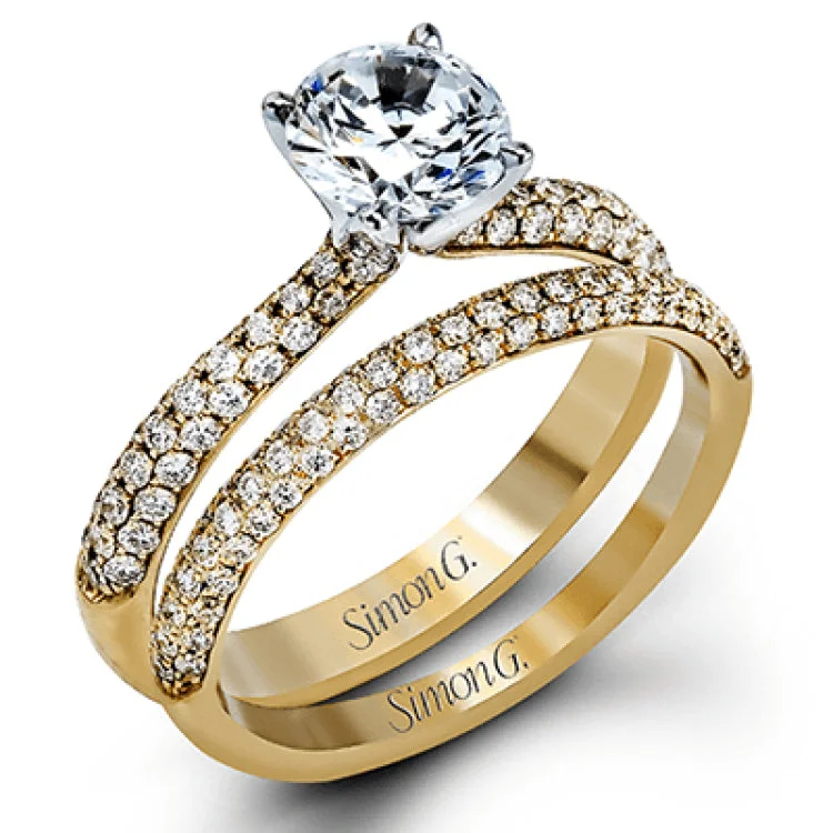 Women’s pear-shaped engagement rings-The classic design of this white gold engagement ring and wedding band set is emphasized by .72 ctw round cut white diamonds.