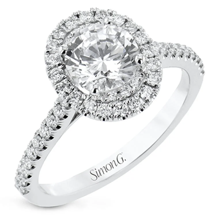 Women’s wedding engagement rings-This diamond engagement ring has a sparkling line of prong set diamonds along the band, leading up to the center halo of round diamonds 0.39 ctw., and has 2 peek-a-boo yellow diamonds 0.02 ctw.