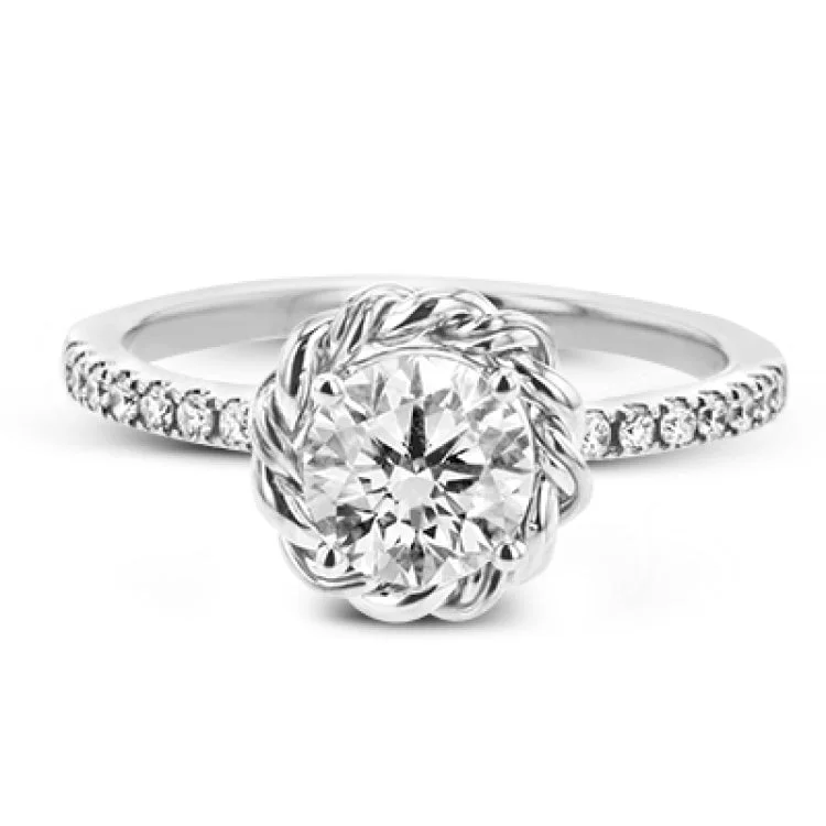 Women’s vintage inspired engagement rings-This ring is certainly a twist on a classic, with the band and halo formed from two tones of 18k gold twisted together, and the engagement ring set with .18 ctw of diamonds.